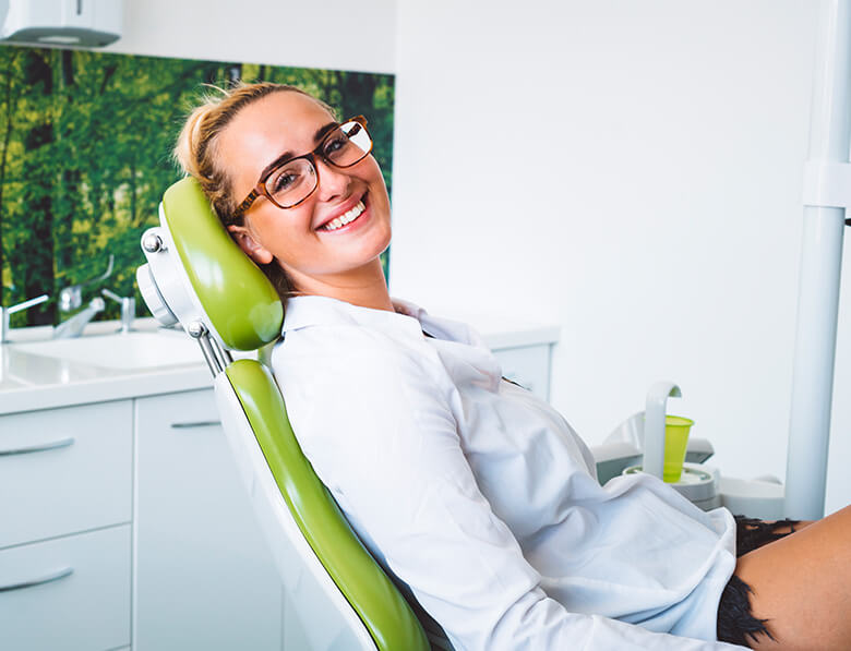 young woman sitting in a dental chair