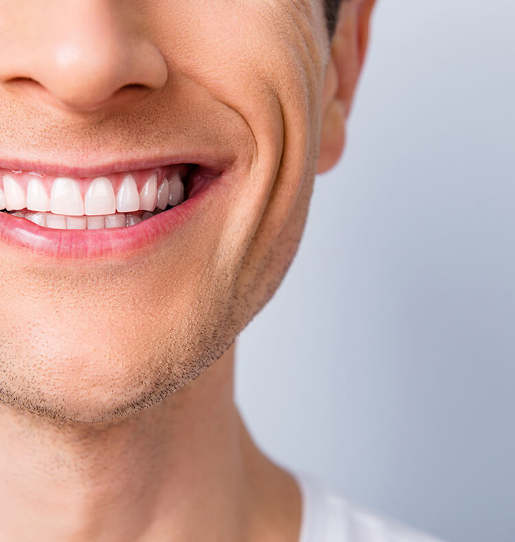 closeup of a man's bright, white smile