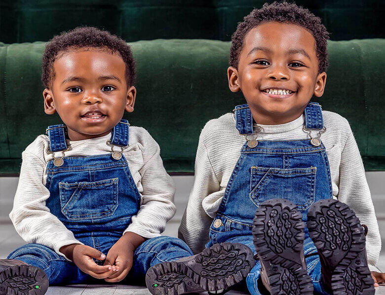 two boys in overalls
